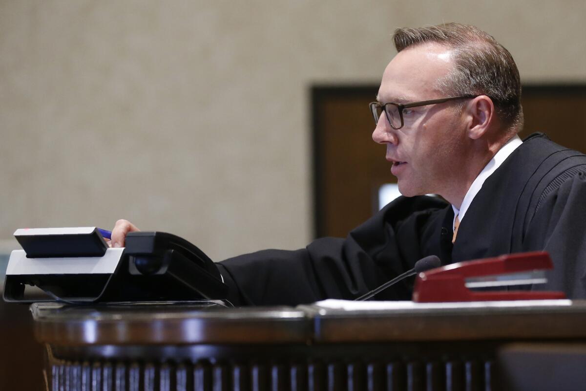 Judge Thad Balkman presides at a hearing in Norman, Okla., on Aug. 19.