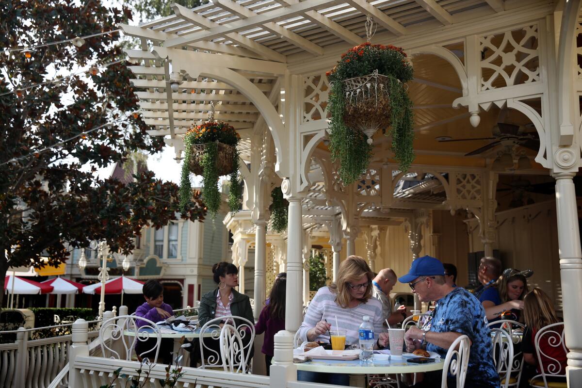  People eat breakfast at the Jolly Holiday Bakery Cafe at Disneyland in 2019. 
