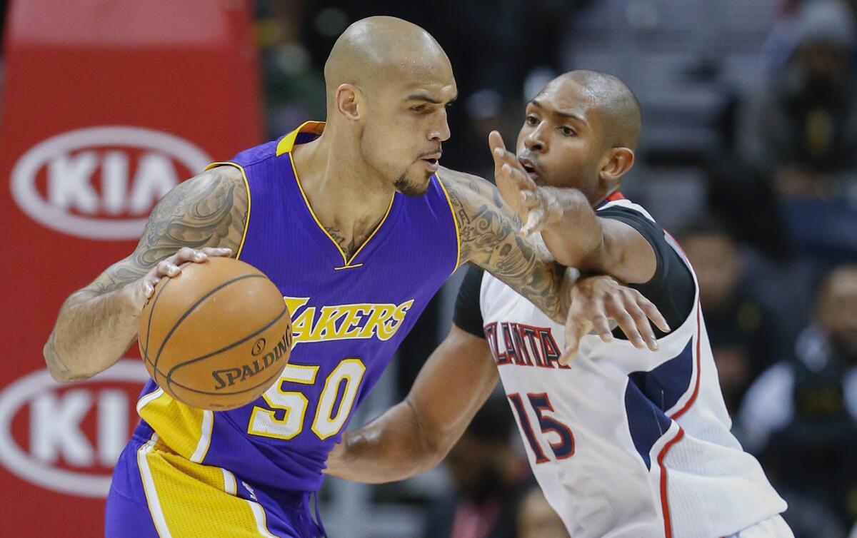 Robert Sacre had four points off the bench for the Lakers in a 114-109 win over the Atlanta Hawks on Nov. 18.