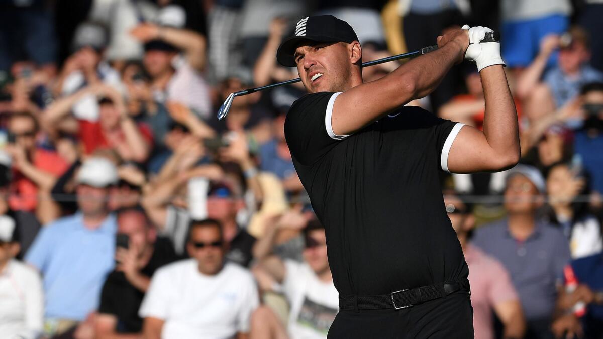 Brooks Koepka drives off the 17th tee during the third round of the PGA Championship on May 18. Koepka holds a seven-stroke lead heading into the final round.