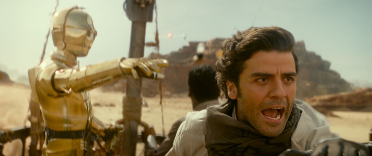 Anthony Daniels as C-3PO, John Boyega and Oscar Isaac in "Star Wars: The Rise of Skywalker."
