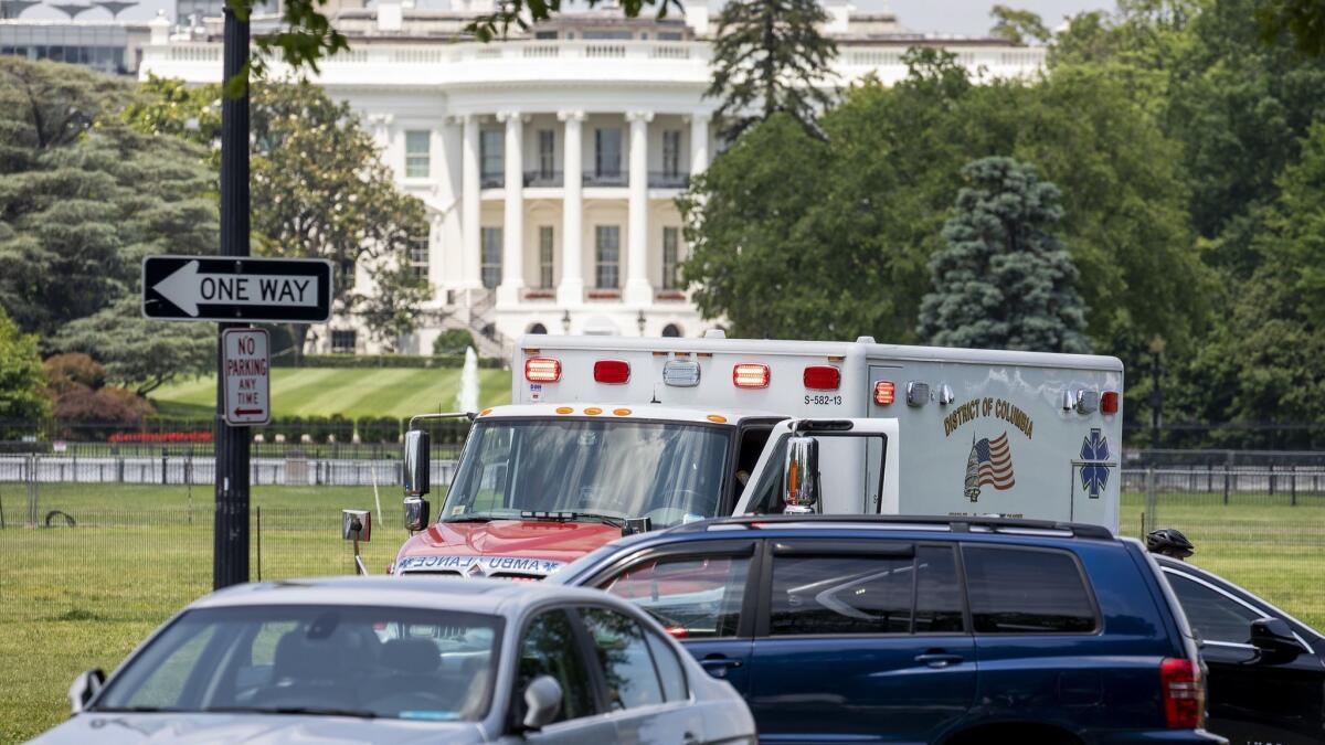 Emergency personnel respond to the Ellipse in Washington on Wednesday after a man set himself on fire near the White House.