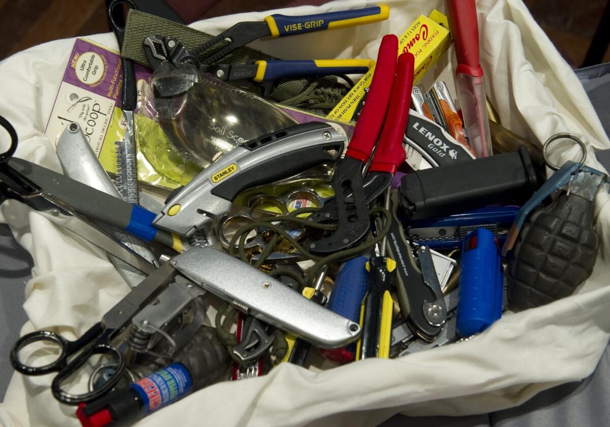 Knives, scissors and other banned items recovered at airport security checkpoints by the Transportation Security Administration.