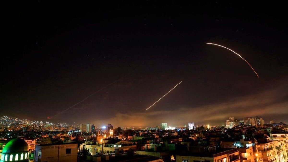 Missiles streak across the Damascus skyline Saturday as the U.S. and its allies launch an attack on Syria, targeting what officials say were chemical weapons facilities.