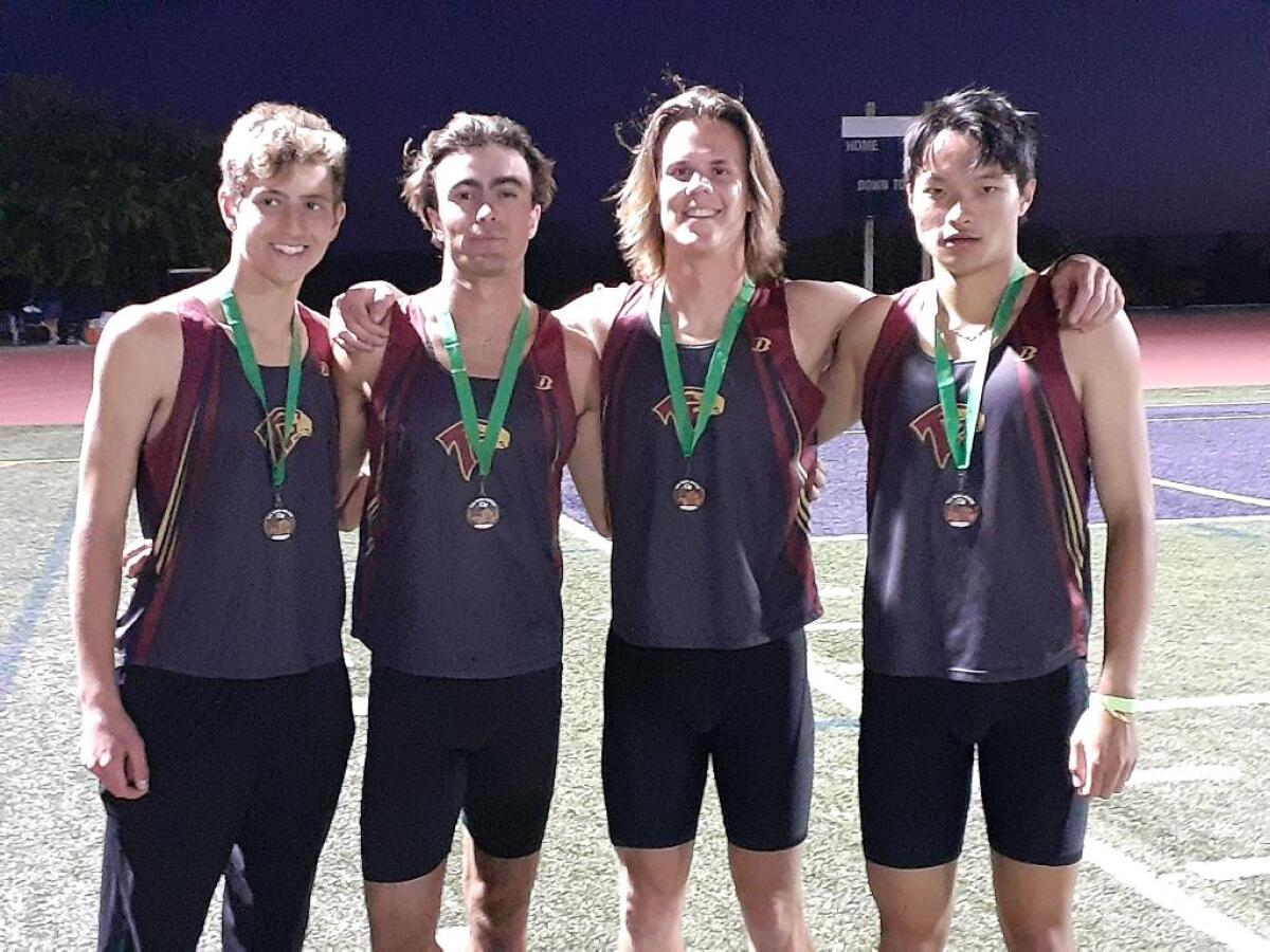 The boys 4x400 relay team Conor Flaharty, Sebastian Barclay, Ryan Thomas and Phillip Jian.