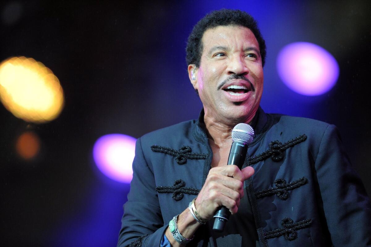 Lionel Richie, seen performing last month in France, will be named the 2016 MusiCares Person of the Year at a ceremony next year.