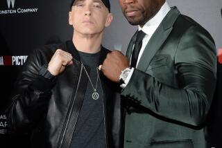 Eminem, left, and 50 Cent attend the premiere of "Southpaw" at the AMC Loews Lincoln Square on Monday, July 20, 2015, in New York. (Photo by Evan Agostini/Invision/AP)