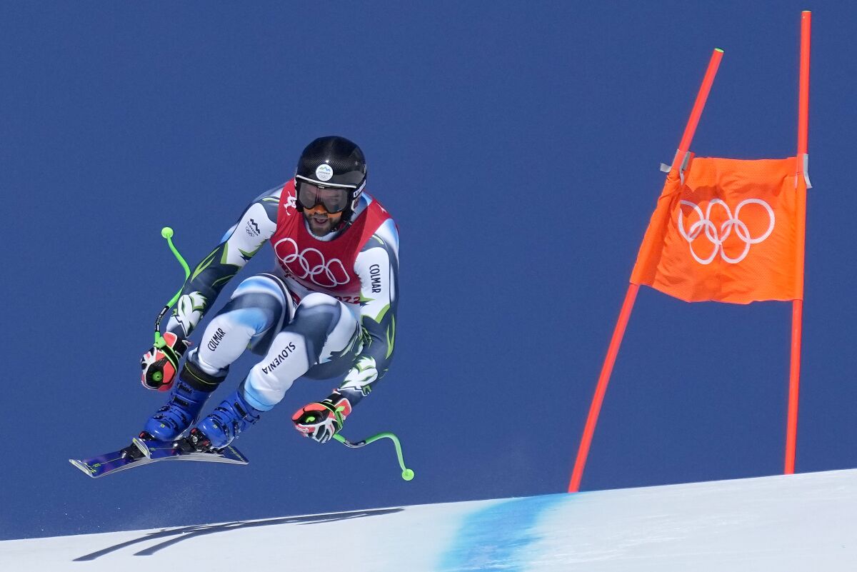 Slovenia's Bostjan Kline goes airborne over a crest during a men's downhill skiing training run Friday.