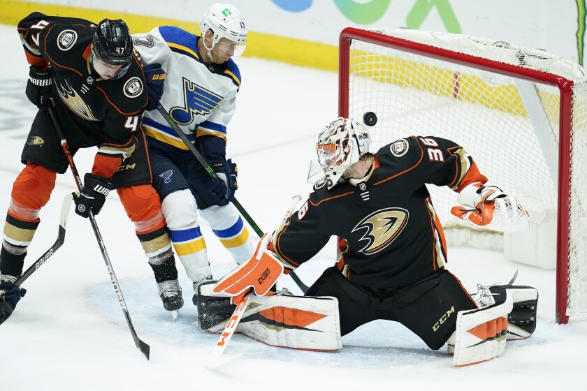 The puck flies past Ducks goaltender John Gibson for a goal.