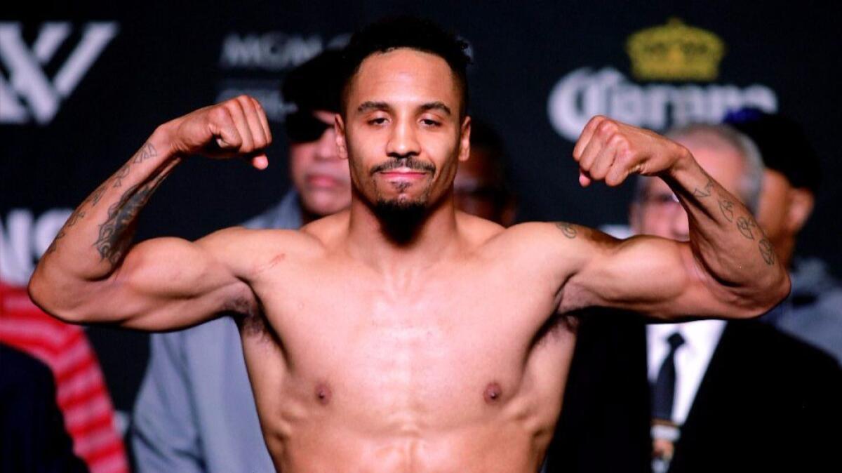 Boxer Andre Ward flexes during his weigh-in Friday ahead of his light-heavyweight fight against Sergey Kovalev on Saturday.