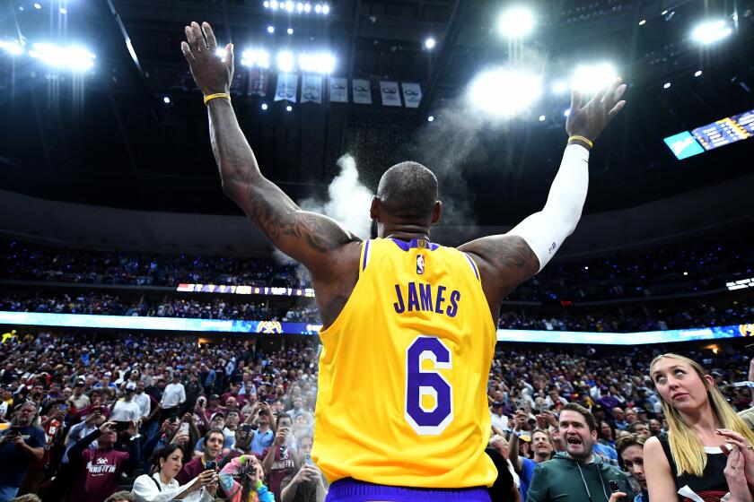 Denver, Colorado May 16, 2023-Lakers LeBron James tosses powder before Game 1.