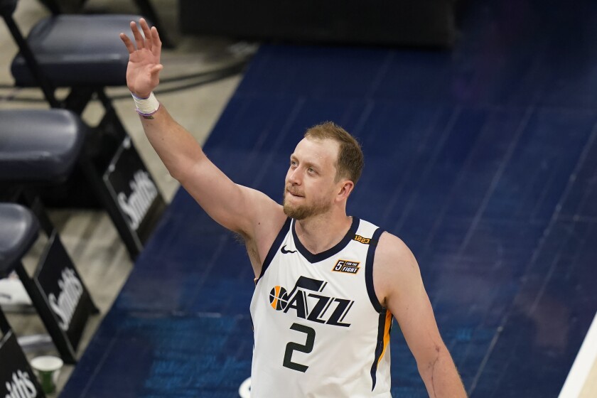 Utah Jazz guard Joe Ingles (2) waves to the crowd following the team's NBA basketball game against the Indiana Pacers on Friday, April 16, 2021, in Salt Lake City. (AP Photo/Rick Bowmer)