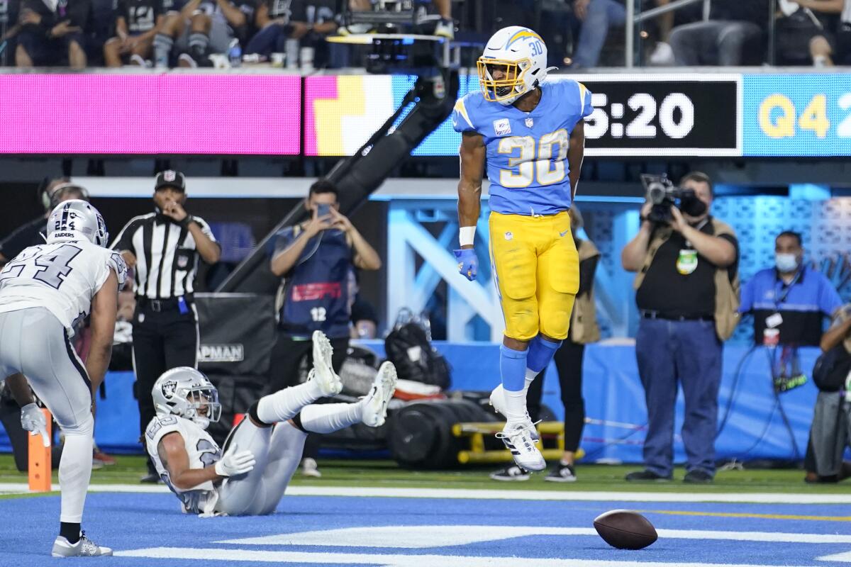 Chargers running back Austin Ekeler celebrates after scoring a touchdown in the fourth quarter.
