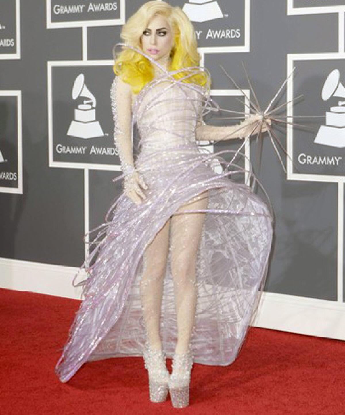Lady Gaga is in orbit in a Giorgio Armani Privé dress and crystal-encrusted stockings and platforms.
