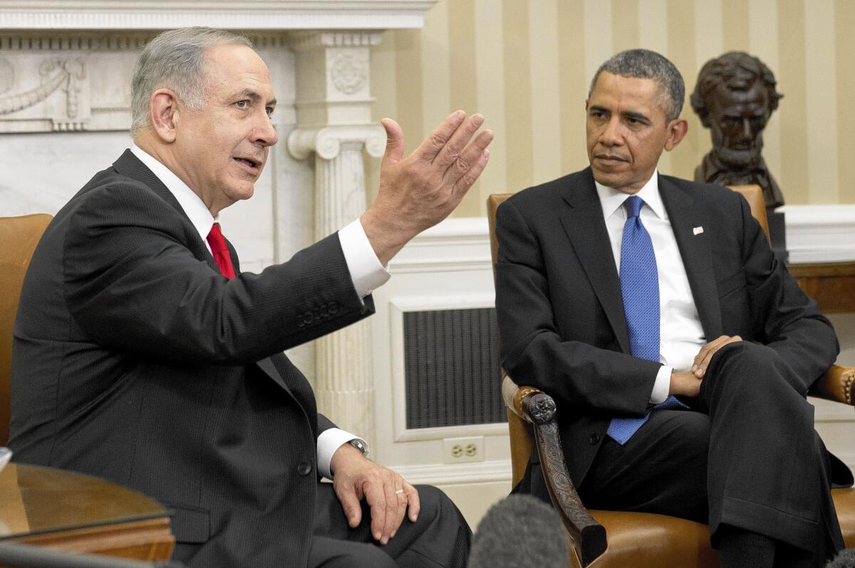 President Obama listens to Israeli Prime Minister Benjamin Netanyahu during a meeting in the Oval Office.