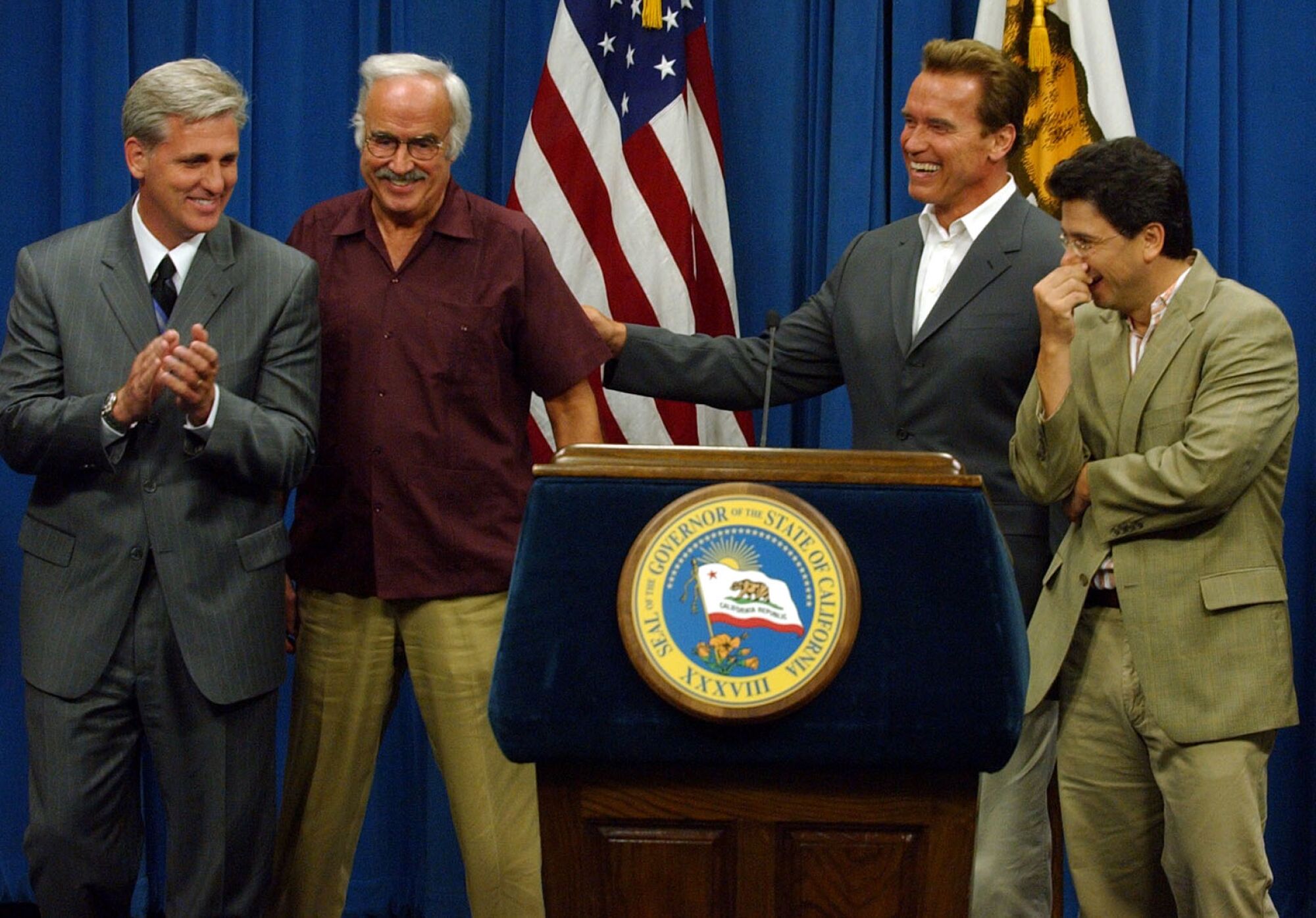 Gov. Arnold Schwarzenegger, second from right, jokes with legislative leaders including Assemblyman Kevin McCarthy in 2004.