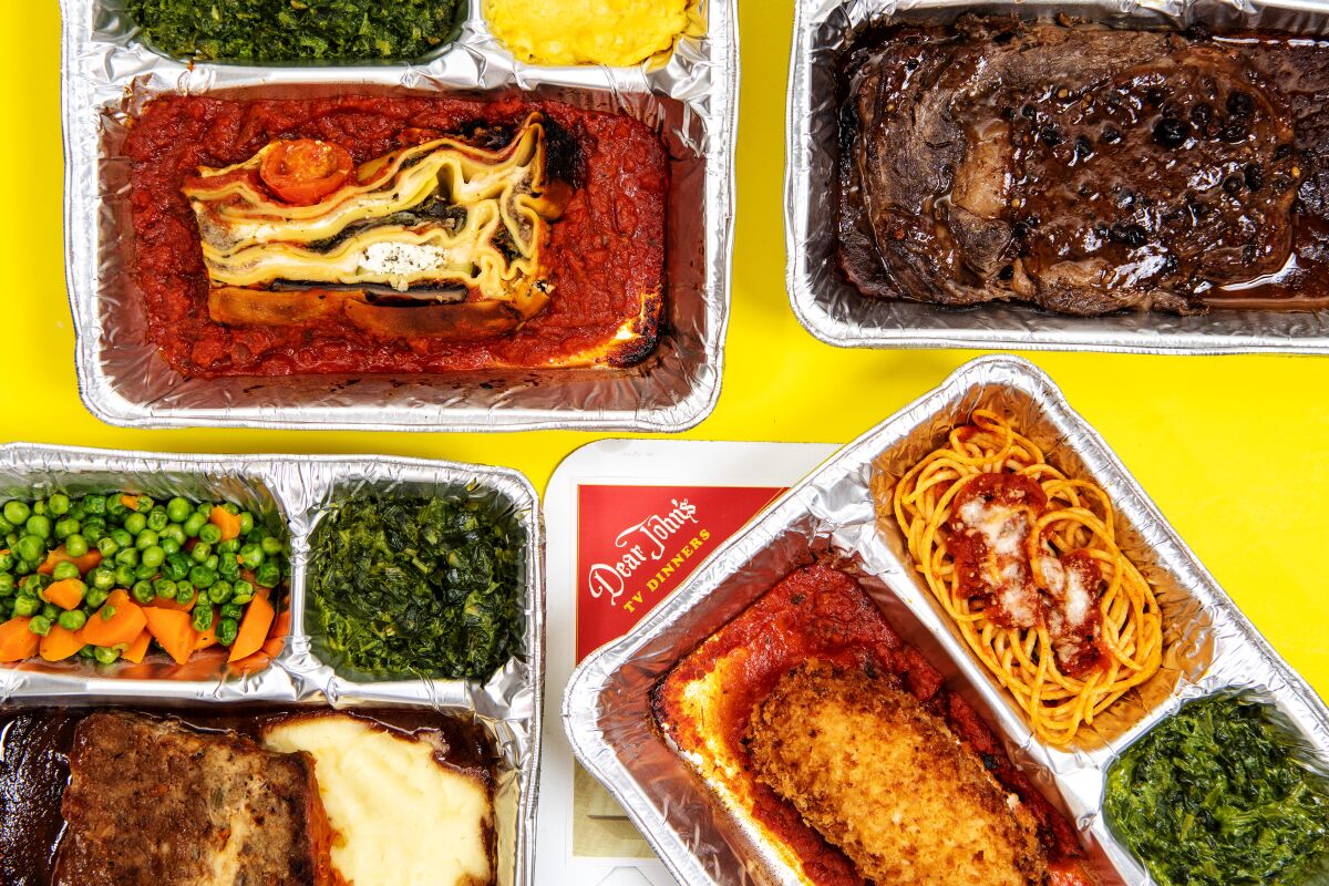 Clockwise from top left, vegetable lasagna, steak au poivre, chicken Parmesan and meatloaf "salisbury" TV dinners from Dear John's. The meals are available for takeout at Röckenwagner market in Culver City.