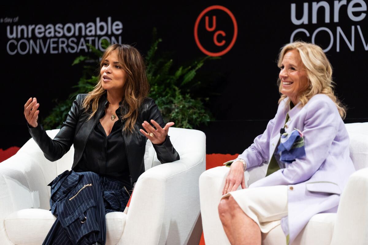 Halle Berry and First Lady Jill Biden onstage at the "A Day of Unreasonable Conversation" conference in Los Angeles.