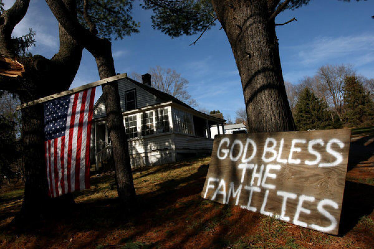 In the days following the shooting, this sign stood in front of a home near Sandy Hook Elementary in support of the families who lost loved ones in the rampage. The Connecticut attorney general has cleared the way for donations to be distributed to families and the community.