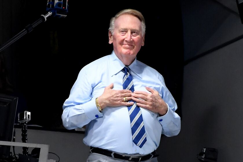 LOS ANGELES, CALIFORNIA SEPTEMBER 20, 2016-Dodgers announcer Vin Scully greets the crowd.