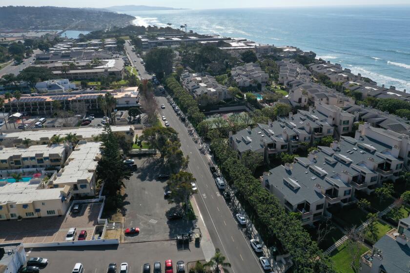 SOLANA BEACH, CALIF. -- TUESDAY, JANUARY 14, 2020: An aerial view of the site of a proposed affordable housing project near million-dollar condos on S. Sierra Ave, Solana Beach, a parking lot behind Sand Pebbles Resort in Solana Beach. It's a 10-unit project that has been in the works for the last 10 years and has yet to break ground in Solana Beach, Calif., on Jan. 14, 2020. (Allen J. Schaben / Los Angeles Times)