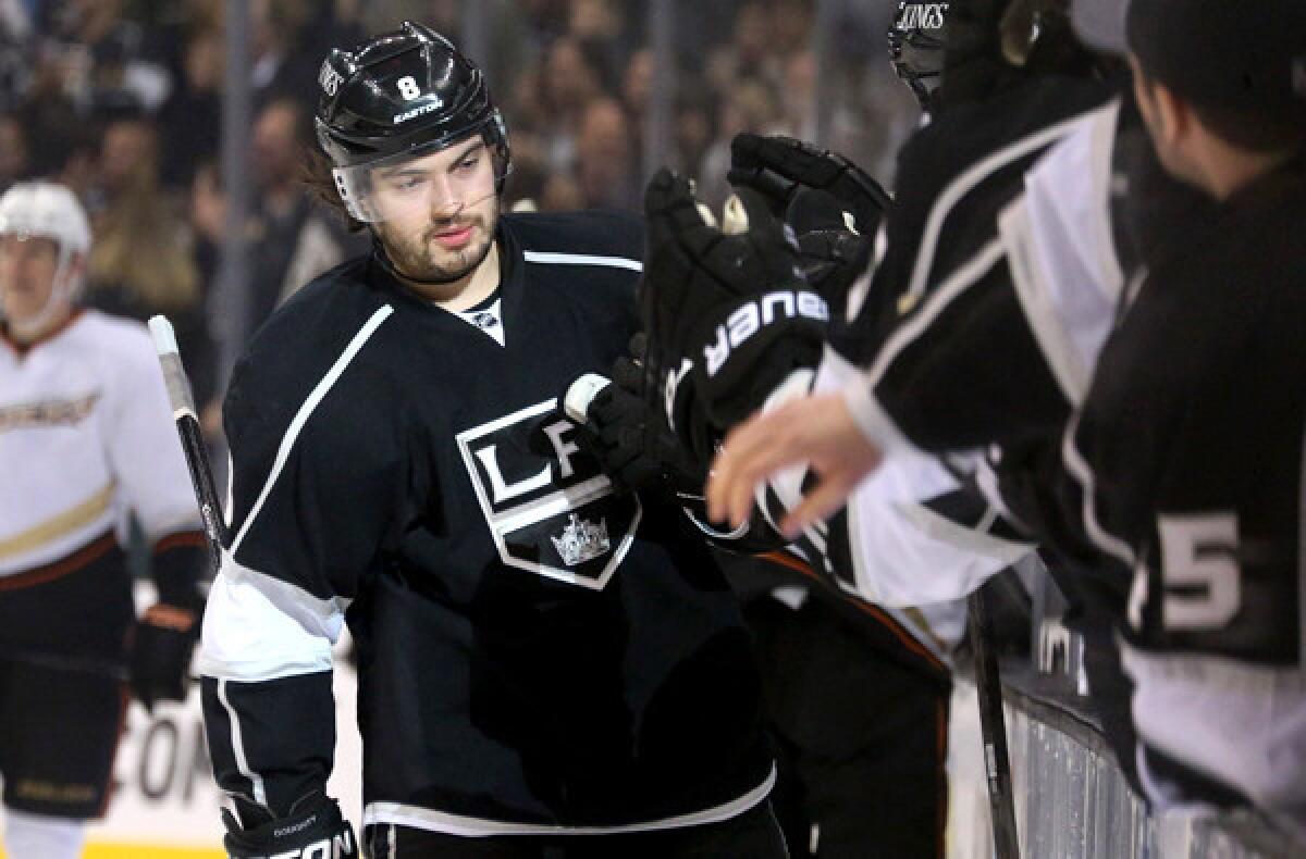 Kings defenseman Drew Doughty is congratulated as he arrives at the bench after scoring a goal against the Ducks in the first period Saturday night.