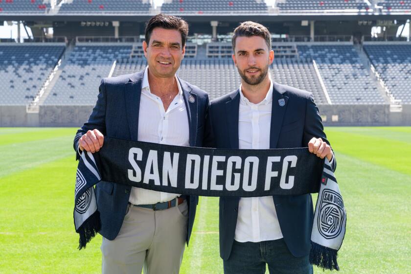 San Diego FC CEO Tom Penn, left, and San Diego FC Sporting Director Tyler Heaps