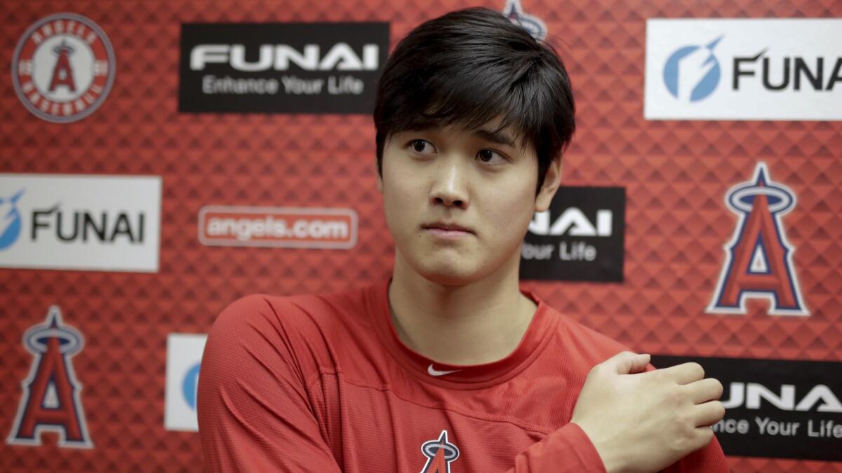 Shohei Ohtani, recovering from Tommy John surgery, talks to the media at their spring baseball training facility in Tempe, Ariz on Feb. 13, 2019.