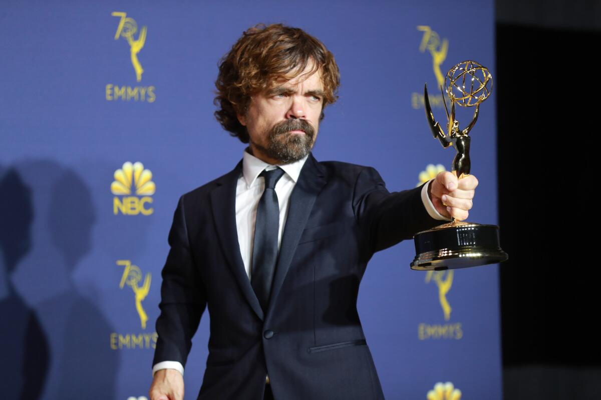 Peter Dinklage holds his Emmy for supporting actor in a drama series at the 70th Primetime Emmy Awards.