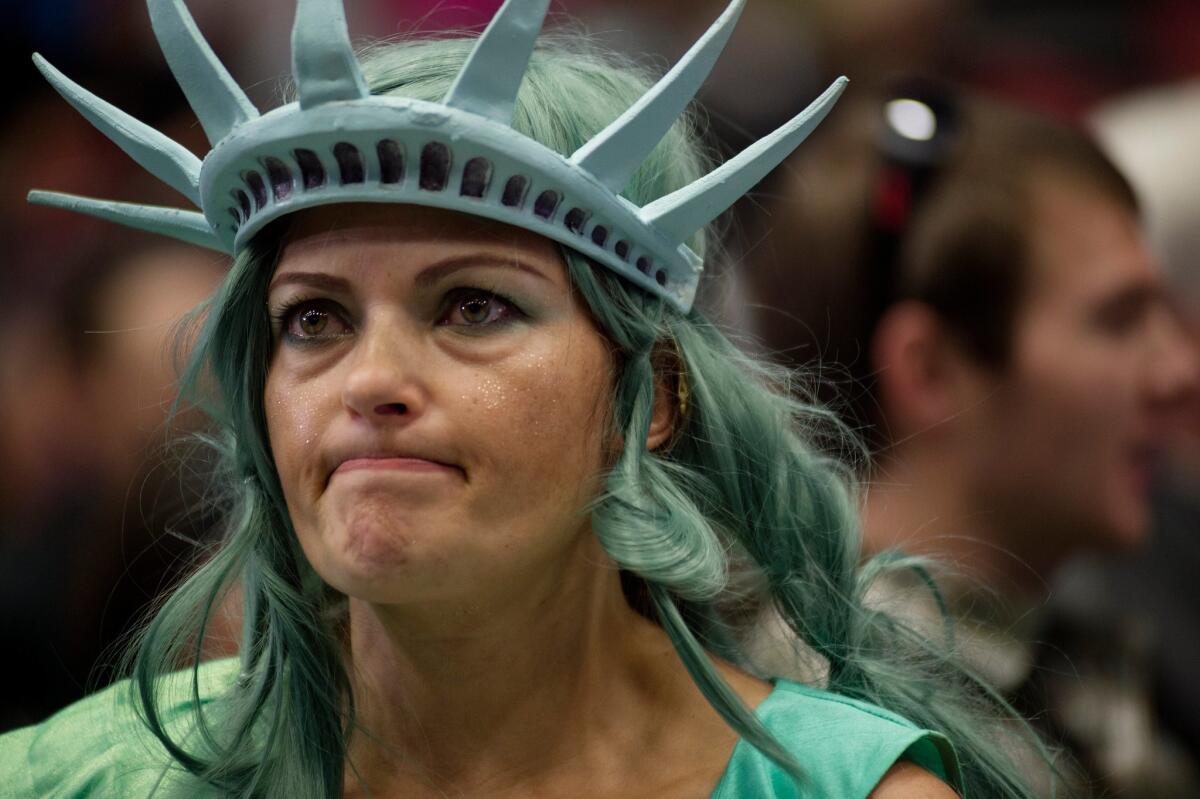 Mary Simcox of Portland, Mich., dressed as Lady Liberty before a Donald Trump campaign rally at the DeltaPlex in Grand Rapids, Mich., on Monday.