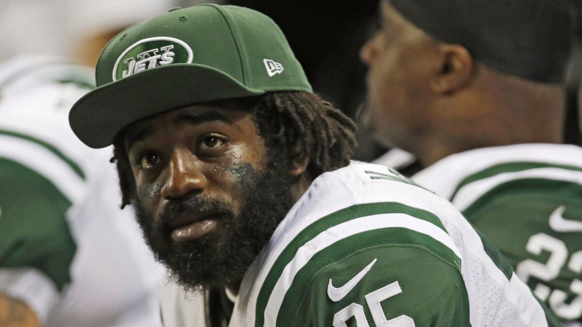 In this Nov. 18, 2012, file photo, New York Jets running back Joe McKnight watches from the bench during the fourth quarter of a game against the St. Louis Rams.