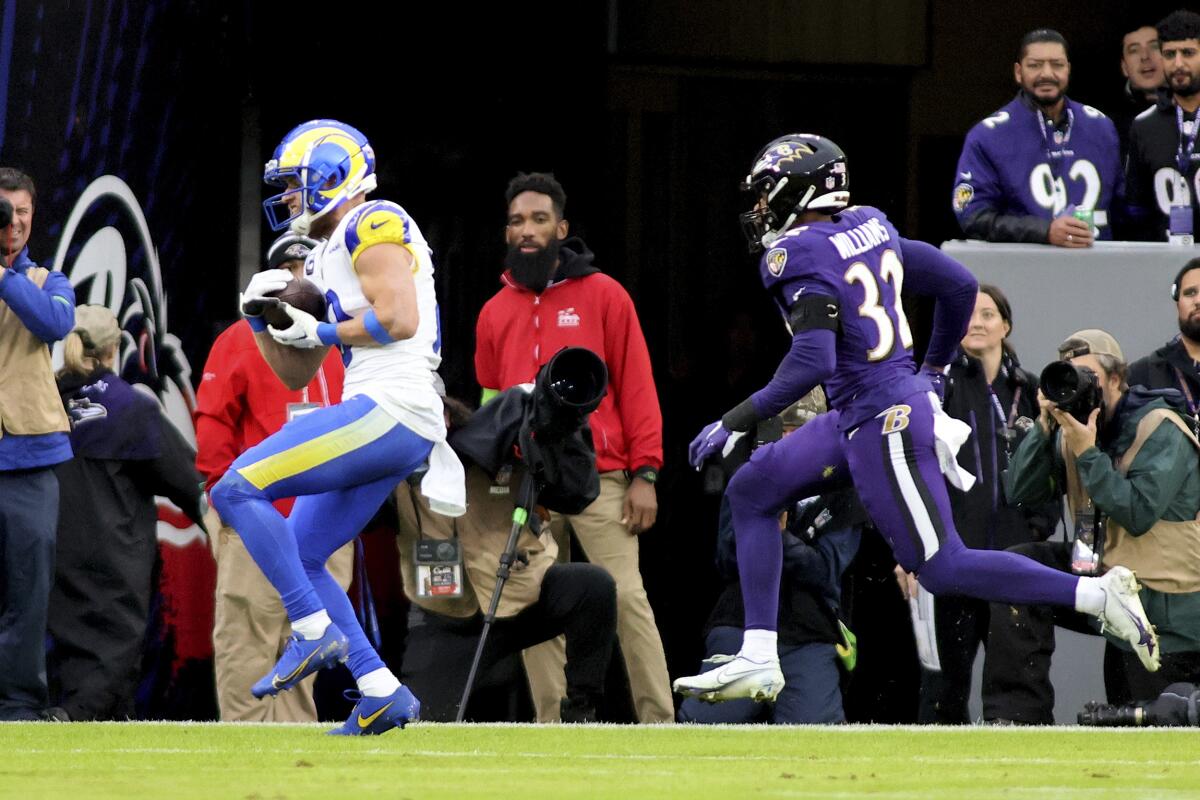 Rams receiver Cooper Kupp (10) catches a touchdown pass in the corner of the end zone against the Ravens.