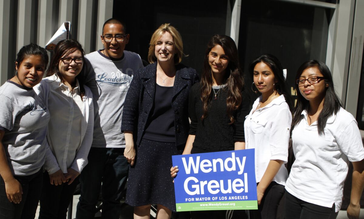 Los Angeles mayoral candidate Wendy Greuel poses for a picture with students from Camino Nuevo Charter School.