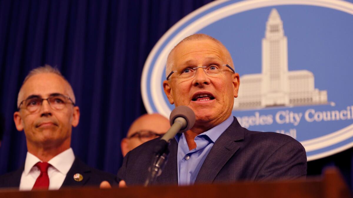 Los Angeles City Councilmen Mitch O'Farrell, left, and Mike Bonin speak Tuesday about the need to improve the city's new trash recycling program.