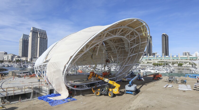 In this Feb. 5 photo, construction crews work on the San Diego Symphony's year-round outdoor concert venue dubbed "The Shell" at Embarcadero Marina Park South behind the San Diego Convention Center. On Thursday, symphony officials announced its opening will be pushed from July to 2021.
