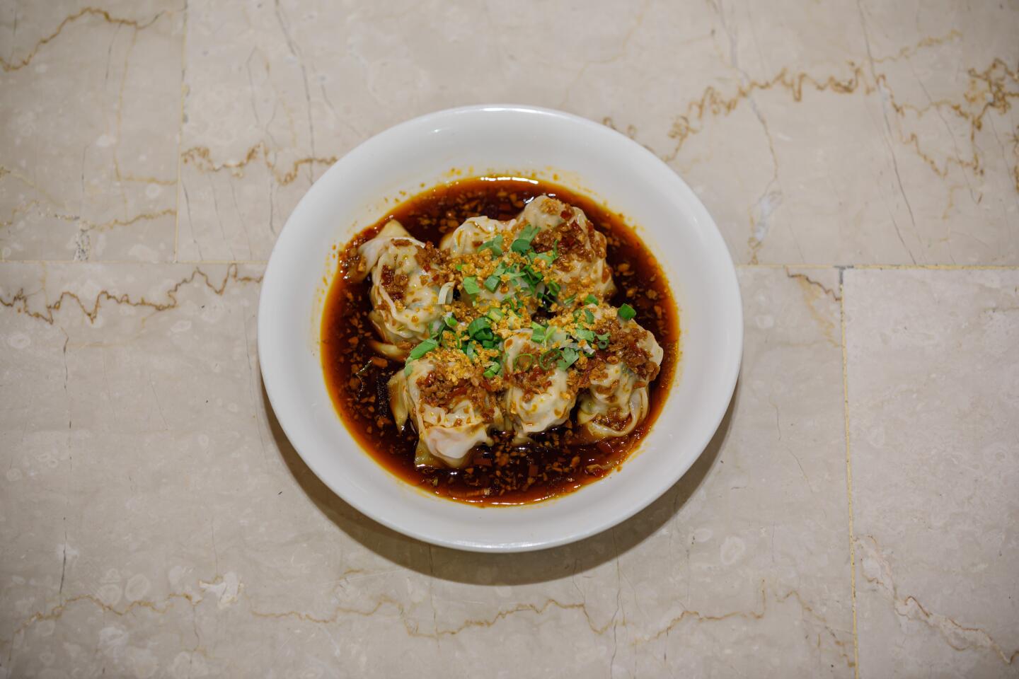 Pork dumplings in a hot chile vinaigrette