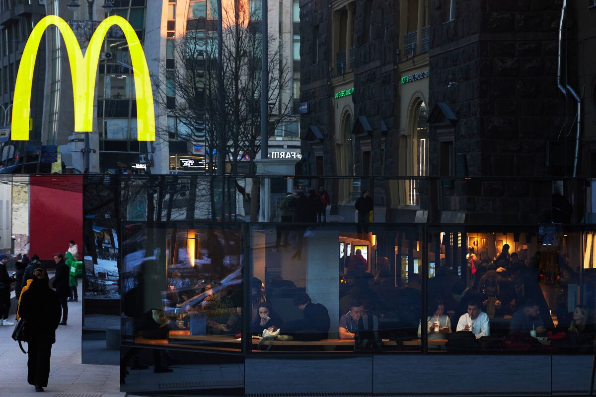 Customers visit the first Russian McDonald's at Pushkin Square in Moscow, Russia. 