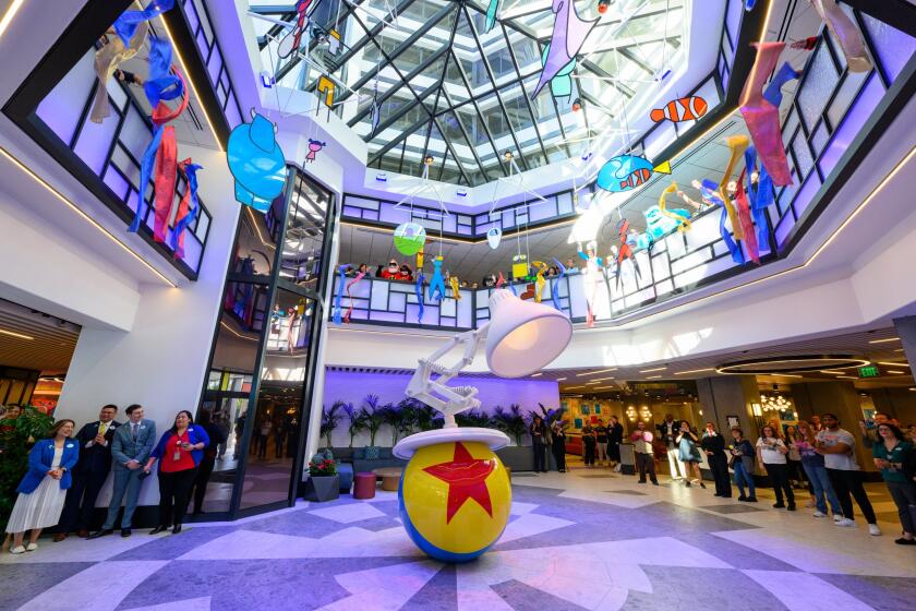 A lamp looks ready to bounce on a ball in the lobby of the Pixar Place Hotel.