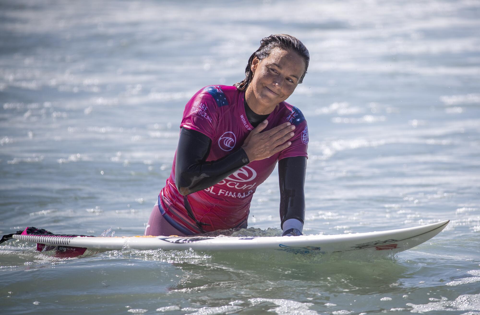 Sally Fitzgibbons of Australia holds a hand to her heart after her defeat by Tatiana Weston-Webb.