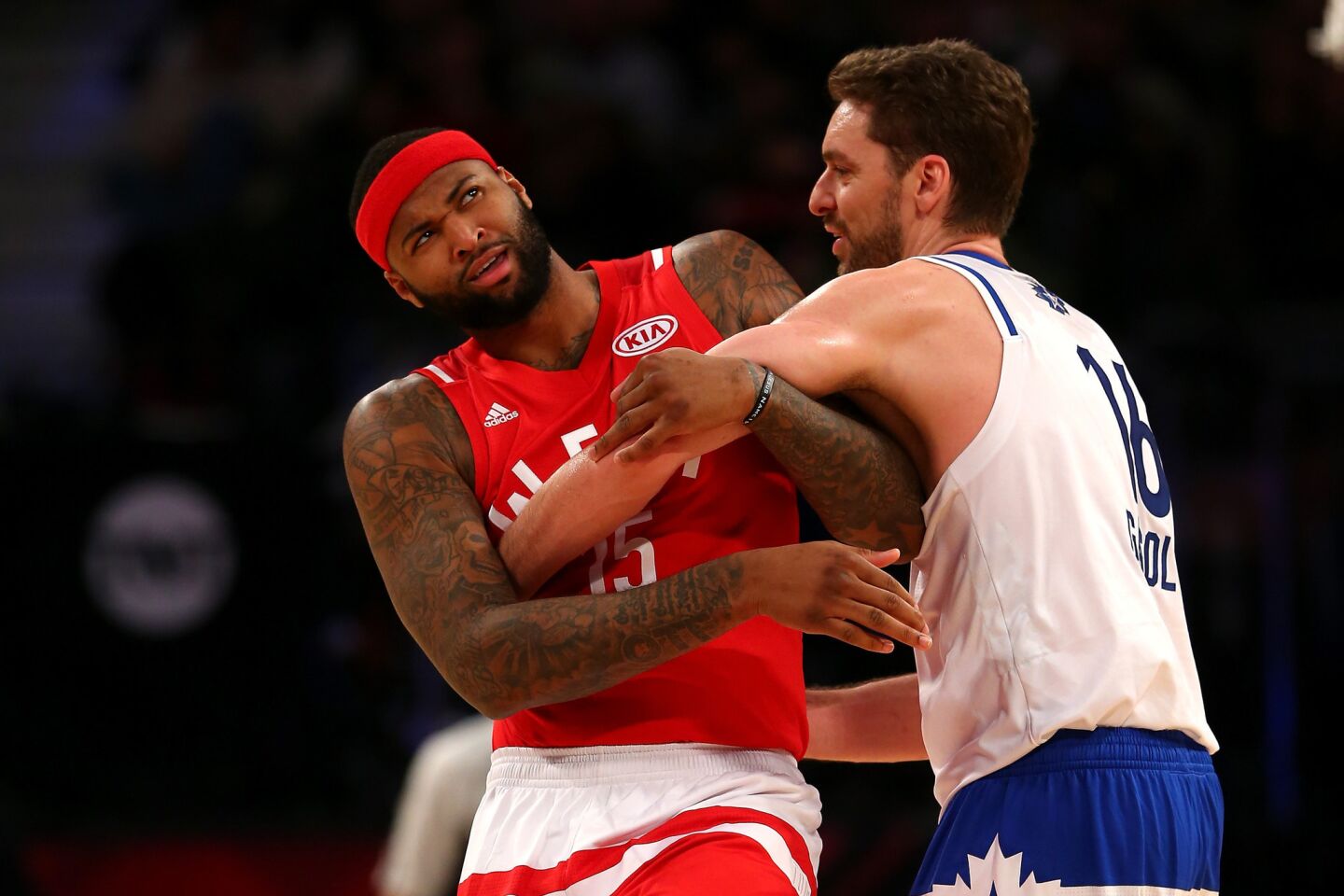Bulls center Pau Gasol of the East gets tangled with Kings center DeMarcus Cousins during first-half action.