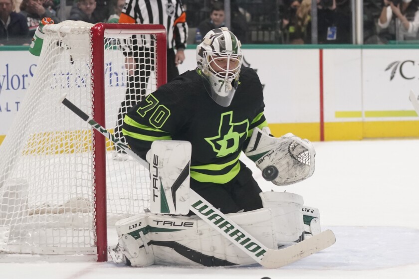 Dallas Stars goaltender Braden Holtby (70) blocks a shot during the second period of an NHL hockey game against the Colorado Avalanche in Dallas, Sunday, Feb. 13, 2022. (AP Photo/LM Otero)