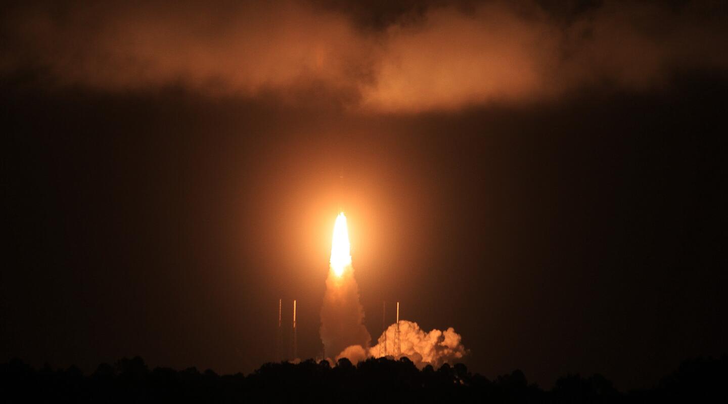 Atlas V rocket launches with satellite