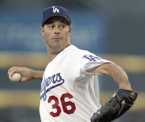 Dodgers starting pitcher Greg Maddux takes aim against the Colorado Rockies in the first inning.