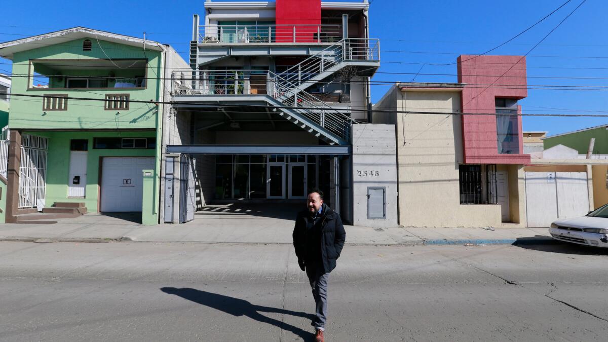 Architect Aaron Gutierrez, of the firm Amorphica, stands before his Tijuana studio.