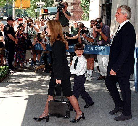 Caroline Kennedy Schlossberg, son Jack and her husband, Edwin Schlossberg, leave their New York apartment en route to a Mass to remember her brother, John F. Kennedy Jr., and his wife, who were killed July 16, 1999, in a plane crash.