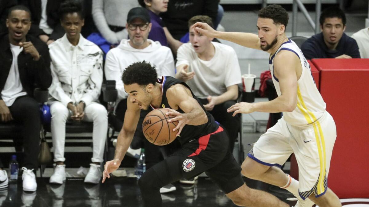 Clippers guard Jerome Robinson steals the ball from Warriors guard Klay Thompson during Game 4 of the NBA Western Conference quarterfinals at Staples Center on April 21.