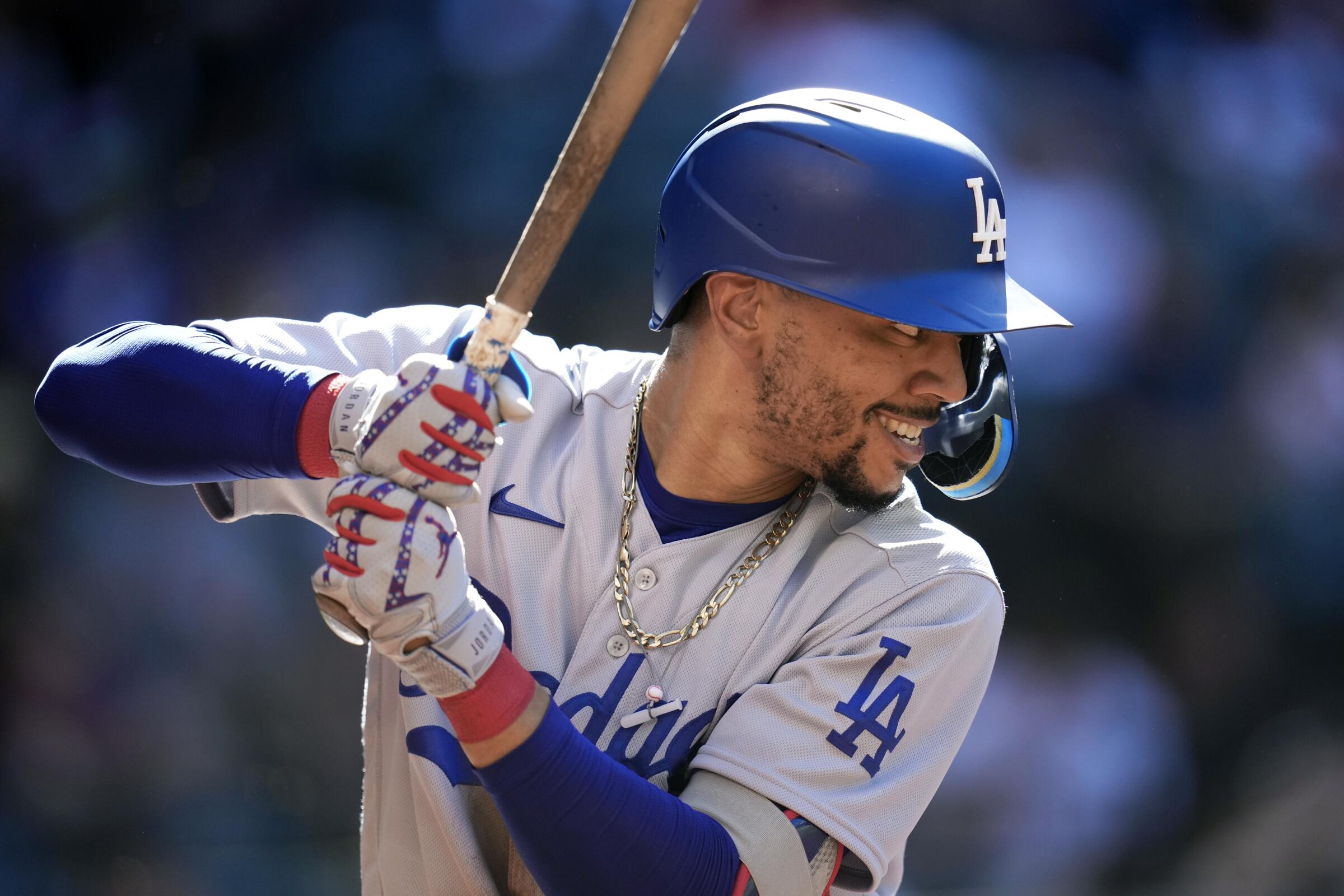 Dodgers right fielder Mookie Betts bats against the Arizona Diamondbacks on April 9.