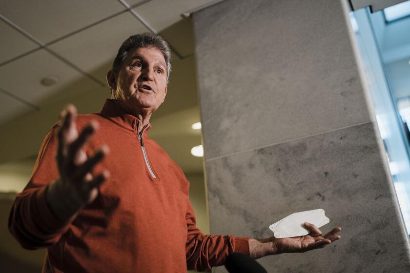 WASHINGTON, DC - JANUARY 18: Sen. Joe Manchin (D-WV) speaks during a press availability ahead of a Senate democratic caucus meeting on voting rights and the filibuster on Capitol Hill on Tuesday, Jan. 18, 2022 in Washington, DC. The Senate began debate Tuesday on an effort to enact sweeping voting rights reforms. (Kent Nishimura / Los Angeles Times)