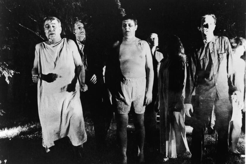 A line of undead 'zombies' walk through a field in the night in a still from the film, 'Night Of The Living Dead,' directed by George Romero, 1968. (Photo by Pictorial Parade/Getty Images) ** OUTS - ELSENT, FPG, CM - OUTS * NM, PH, VA if sourced by CT, LA or MoD **