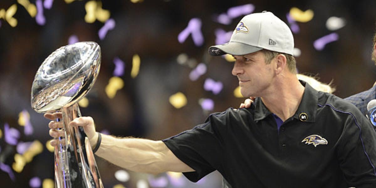 Head coach John Harbaugh of the Baltimore Ravens holds the Vince Lombardi Trophy following their 34-31 victory over the San Francisco 49ers in Super Bowl XLVII at the Mercedes-Benz Superdome.
